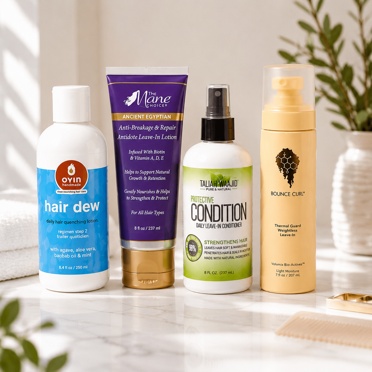 Four leave-in conditioners often recommended for low porosity hair—Oyin Hair Dew, The Mane Choice Ancient Egyptian Anti-Breakage & Repair Antidote Leave-In Lotion, Taliah Waajid Protective Condition Daily Leave-In Conditioner, and Bounce Curl Thermal Guard Weightless Leave-In—arranged on a neutral bathroom vanity with soft natural lighting. The image reflects different formulation styles for low porosity hair and illustrates that leave-in conditioner selection depends on hair behavior and formulation, not protein-free rules.